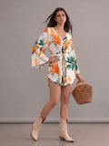 Robe bohème blanche et orange col en V manches chauve-souris imprimées